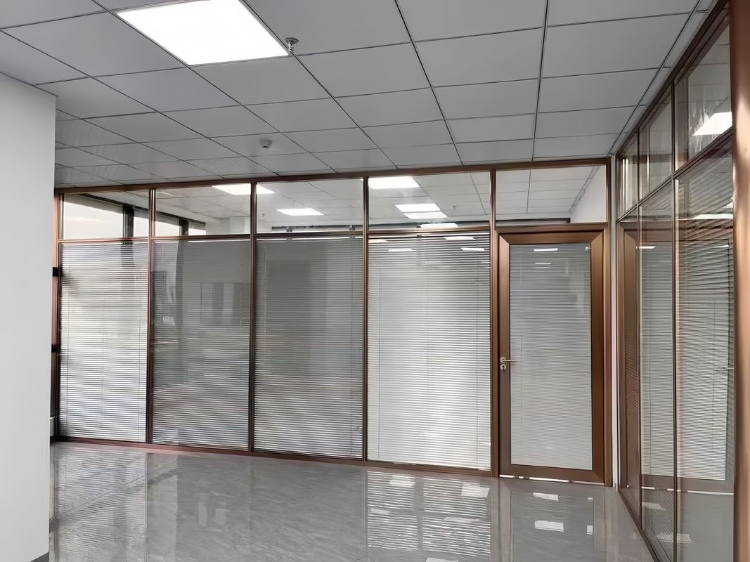 Gold Framed Dual-Level Glass Partition Wall with Blinds